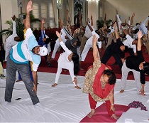 First Lady of State Smt Rita Rajkhowa along with Raj Bhawan officials and their family members participating in the International Yoga Day at Raj Bhawan, Itanagar on 21st June 2015.